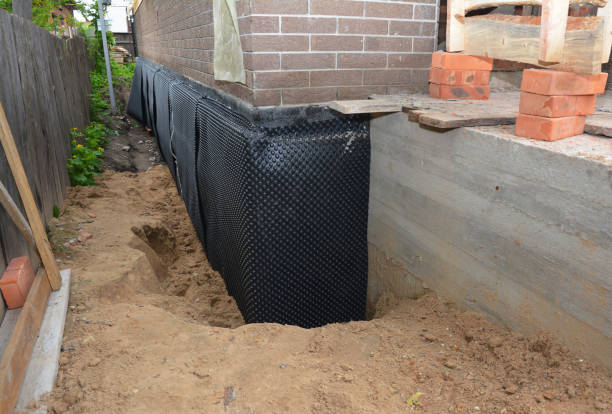 Happy homeowners after waterproofing job in Bloomdale
